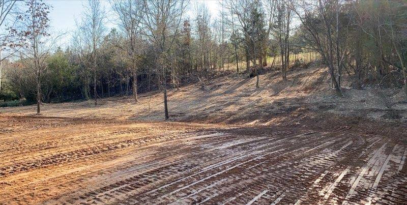 Cleared lot rough graded with fresh dirt